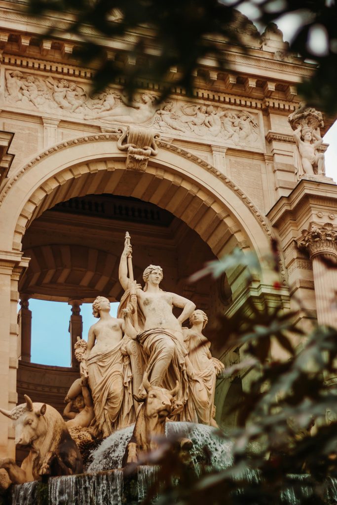 Intricate sculptures of the Palais Longchamp fountain in Marseille, France, captured in a vertical shot.
